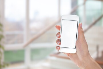 Hand holding modern Smartphone with a blank screen