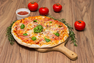 Italian pizza Capricciosa  with cheese, tomato sauce and basil