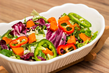 Bowl of freshly salad with pumpkin