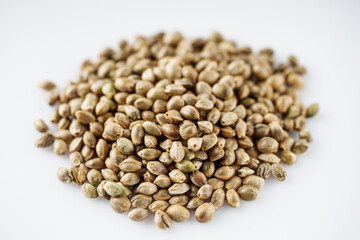 natural hemp seeds on a white acrylic background