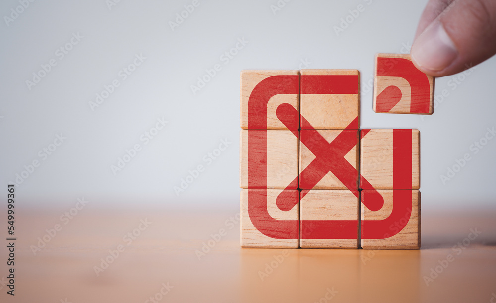 Poster Hand assembly red tick mark which print screen on wooden cube block t , Approve and reject business and document concept.