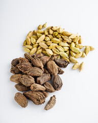 barrel dried black cardamom on a white background