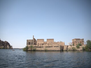 Fototapeta na wymiar Philae temple and Greco-Roman buildings seen from the Nile, a temple of Isis, love. Aswan. Egyptian