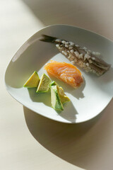 Dinner plate with healthy meal with unsaturated fats with fatty fish, herring, salmon and avocado