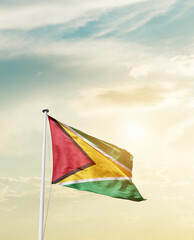 Waving Flag of Guyana with beautiful Sky. 