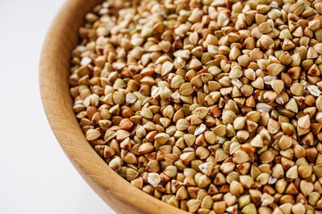 organic raw green buckwheat on a white background