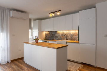 New modern kitchen. New home. Interior photography. Wooden floor.