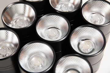 Overhead black LED lamps for a stretch ceiling on a white background. Close-up
