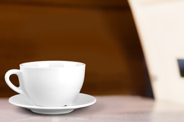 Tasty hot coffee in cup on the table