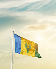 Waving Flag of Saint Vincent and the Grenadines with beautiful Sky.