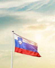 Waving Flag of Slovenia with beautiful Sky.
