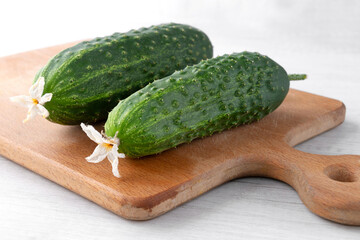 fresh cucumbers on the kitchen board, close-up