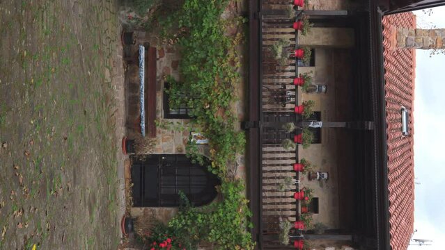 A house in one of the most beautiful villages in Spain, Barcena Mayor, Cantabria, on a windy autumn day. vertical video 