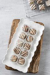 Beautiful and delicious homemade cookies or sweets with white and dark chocolate in retro grunge style.