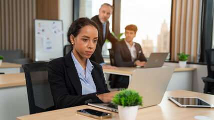 Obraz premium Successful businesswoman working at her office desk, Concept of business risk analysis and assessment