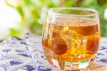 Glass of Japanese plum wine 'Umeshu',Japanese plum wine.Pickled plum wine.