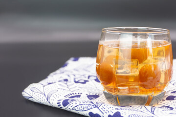 Glass of Japanese plum wine 'Umeshu',Japanese plum wine.Pickled plum wine.