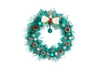 christmas wreath from a green garland on a white background. New Year decoration. Close-up