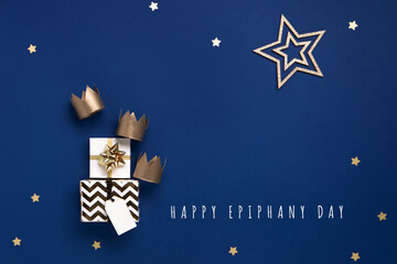 Three gold crowns for Traditional Three King's Day of January 6, blue background.