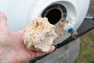 Calcium deposits are hard mineral deposits that latch on to your heating elements of water heater...