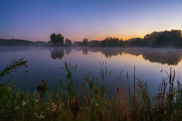 Fototapeta na wymiar summer sunrise over the lake