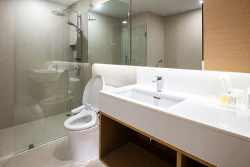 Loft white tile bathroom corner, tub and sink
