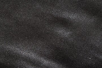 Black fabric with a beautiful shade, macro. Fashion