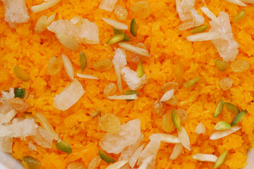 A big white bowl filled with tasty Jollof Rice served 