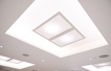 Fluorescent lamp on the white modern ceiling hall