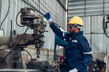 Team of  technician worker checking and repair pressing metal machine at factory, Machine maintenance technician operation concept.