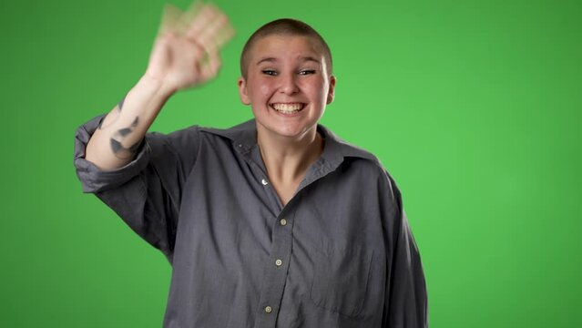Portrait of happy gender fluid non binary young woman 20s smiling waving shout calling inviting with hands at mouth say hey you isolated on green screen background.