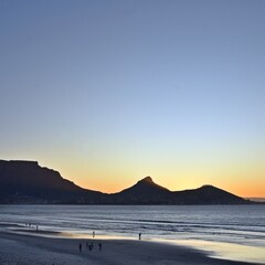 Landscape with the beach in Milnerton and Table Mountain in evening light