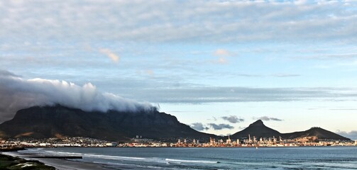 landscape with the beach in Milnerton and Table Mountain at sunrise