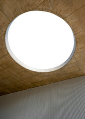 Modern architecture with round hole in the ceiling of concrete