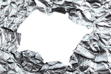Foil background with a hole for an inscription close-up. Foil texture with empty space