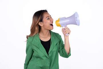 Young asian woman shouts into a megaphone. Isolated white background.
