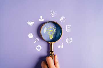 Magnifying glass focus to light bulb icon which for mind, creative, idea, innovation, motivation...