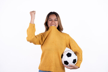 Happy Asian woman football fan cheer up support favorite team with soccer ball isolated on white background.