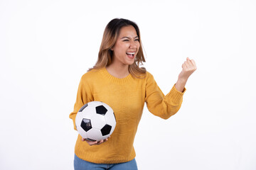 Happy Asian woman football fan cheer up support favorite team with soccer ball isolated on white background.