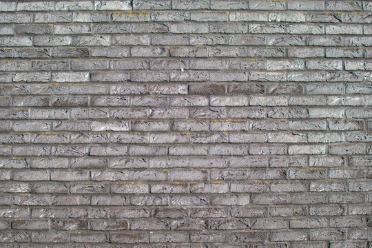 A background of a wall of gray ornamental stone