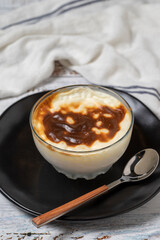 Rice Pudding on a white wood background. Turkish cuisine delicacies. close up