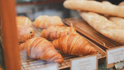 A close up of croissant in a bakery. Concept of winter, warm, vintage cafe, coffee shop or bakery sweet dough. French tasty croissant.