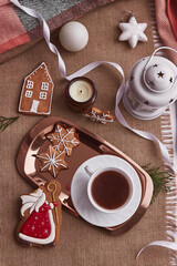 Saint Nicholas Christmas bitten gingerbread cookies and cocoa. Aesthetic seasonal Christmas decorations with hot drink. Traditional holiday in Europe.