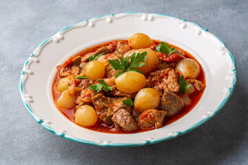 Traditional Greek dish of beef stifado in a sauce. Meat stew, onion stew. Turkish name; sogan yahni or et yahni