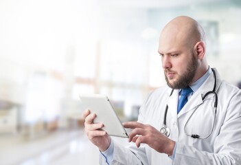 Young doctor hold digital tablet in clinic