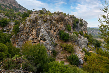 Fototapeta na wymiar Rock tombs of Pinara ancient city in Lycia, Antalya, Turkey
