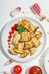 Fried slices Pleurotus eryngii mushrooms with sauce, spices and herbs. Healthy vegan food concept