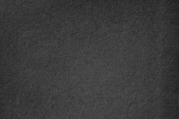Fototapeta na wymiar Macro black background surface paper texture