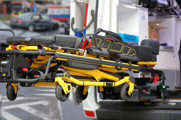 First aid stretcher and ambulance at road accident