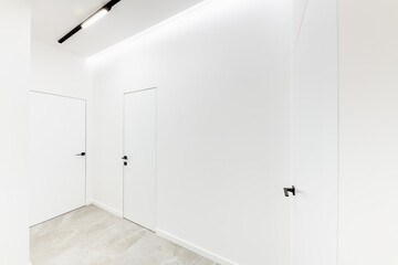 White wall with doors in new home interior design